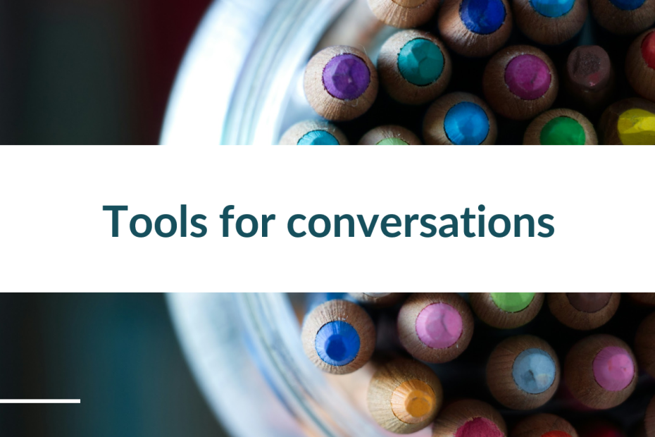 Screenshot of a slide that reads "tools for conversations" on a background image of a tub of coloured pencils